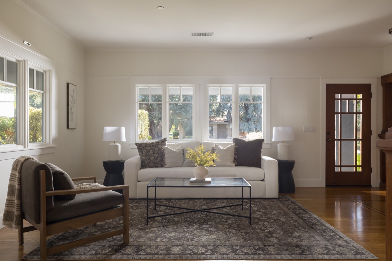 Living room with a Craftsman glass-paneled door