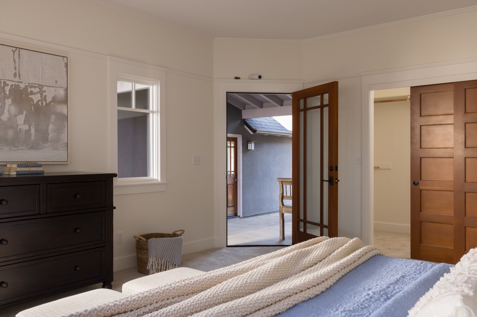 Primary bedroom with door to the outside