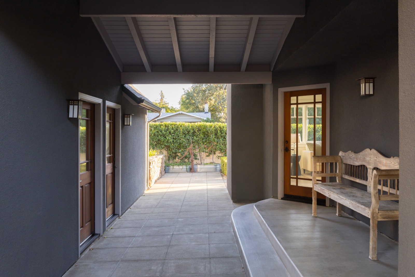 Covered breezeway between the house and garage